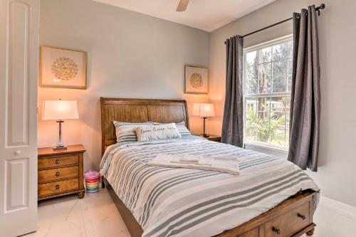 a bedroom with a large bed and a window at St Pete Escape with Patio and Yard 6 Mi to Beach in St Petersburg