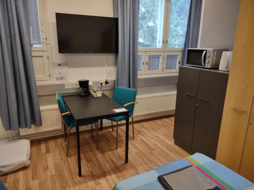 Kuchyň nebo kuchyňský kout v ubytování Hotel 24 - Karihaara - Kemi