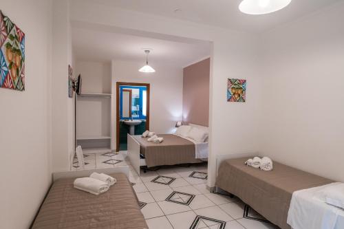 Katil atau katil-katil dalam bilik di Ada Hotel
