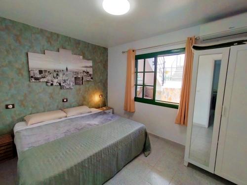 Posteľ alebo postele v izbe v ubytovaní CALMA SUITES Maspalomas