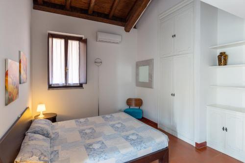 a bedroom with a bed in a room at Cascina cattabreghetta in Pombia
