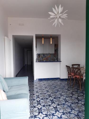 a living room with a couch and a table at Salerno Eremita Apartment in Salerno