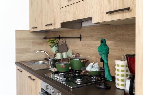 a kitchen with a stove with pots and pans at Itaca in Lido di Fermo