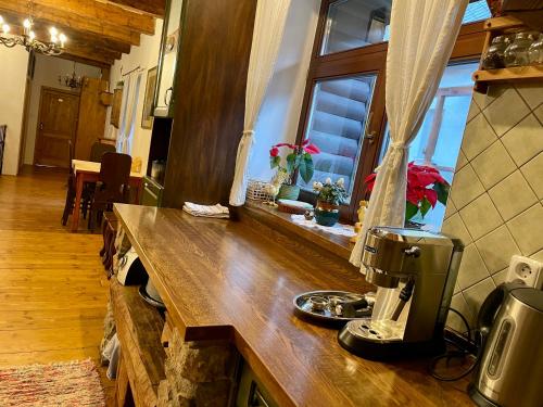 a kitchen with a counter with a coffee maker on it at Chata Vanda in Štrba