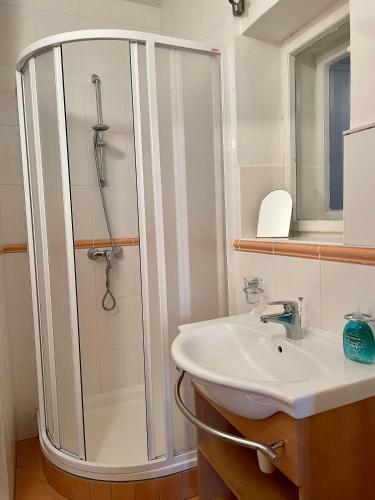 a bathroom with a shower and a sink at Chata Vanda in Štrba