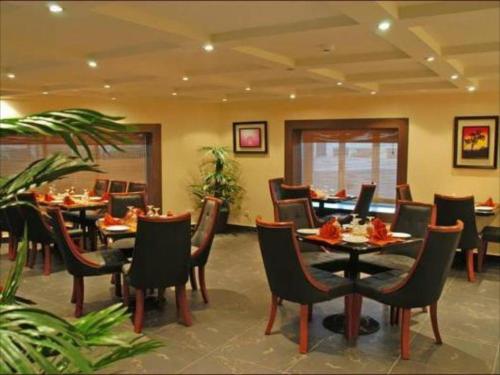 A restaurant or other place to eat at Galaxy Amman Hotel