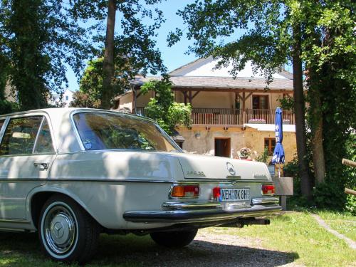 a silver car parked in front of a house at Turmhotel zum Erasmus in Kelheim