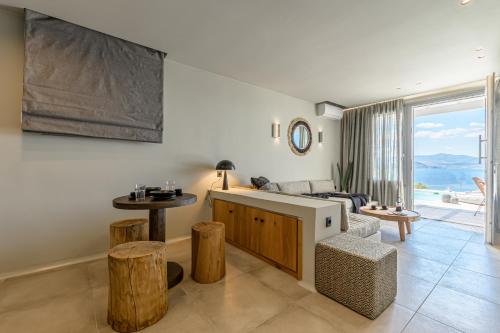 a living room with a couch and a table at Diadema Villa in Naxos Chora