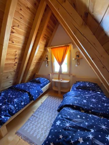 מיטה או מיטות בחדר ב-Cottage Angel