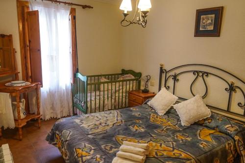 Tempat tidur dalam kamar di CASA MERCEDES-PUERTOMINGALVO