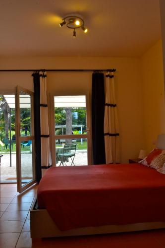 a bedroom with a bed and a sliding glass door at B&B Sotto le Stelle in Fano