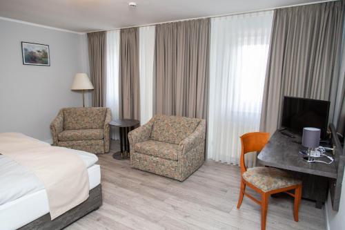 Una cama o camas en una habitación de Hotel Willmeroth Windeck