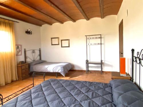 Ένα ή περισσότερα κρεβάτια σε δωμάτιο στο Los baladres