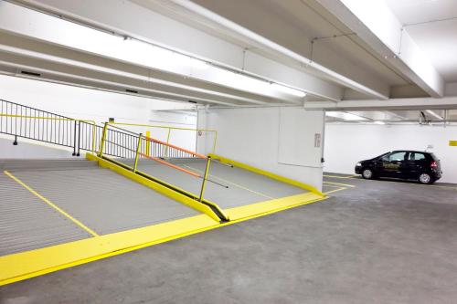 a parking garage with a car parked in it at GuestHouse Mannheim in Mannheim