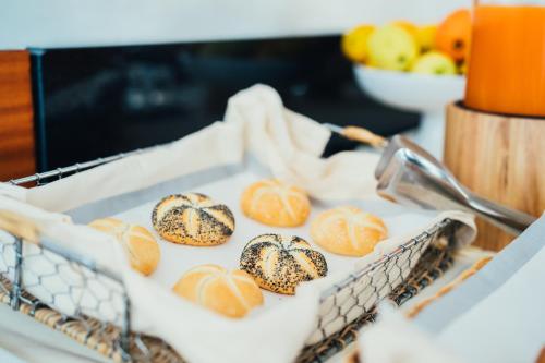 a basket full of croissants on a counter at Arcangelo Roof Hotel in Rimini