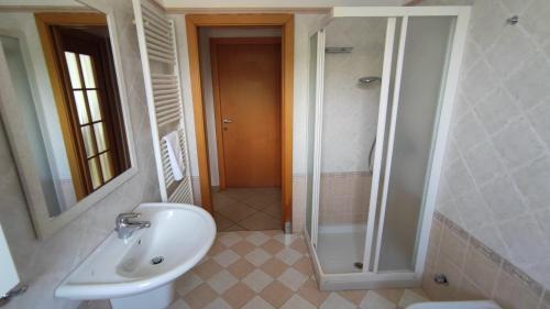a bathroom with a shower and a sink and a toilet at Casa Torboli 2 in Arco
