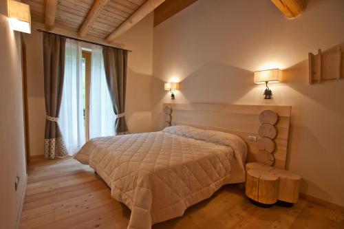 En eller flere senge i et værelse på Agriturismo Ortesida