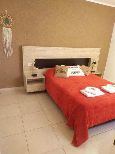 En eller flere senge i et værelse på Apart Anficosta