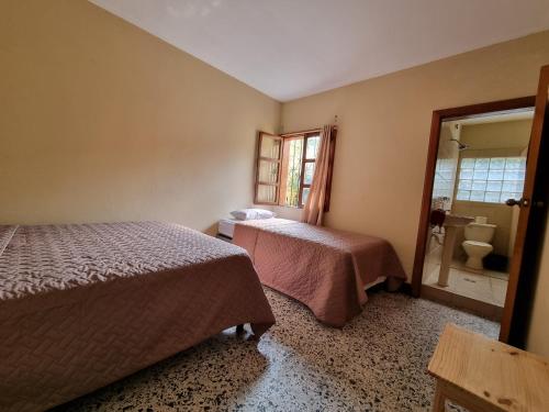 Ένα ή περισσότερα κρεβάτια σε δωμάτιο στο Central Hostel Antigua
