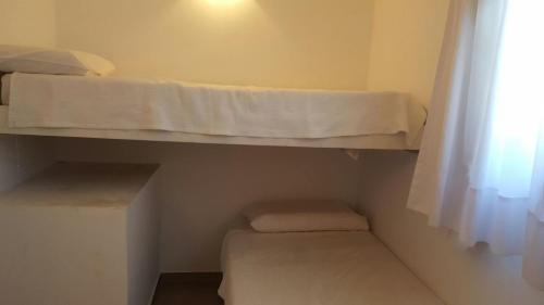 Postel nebo postele na pokoji v ubytování Departamentos Punta Pampa