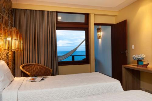 Hotel Pontal de Ubuにあるベッド
