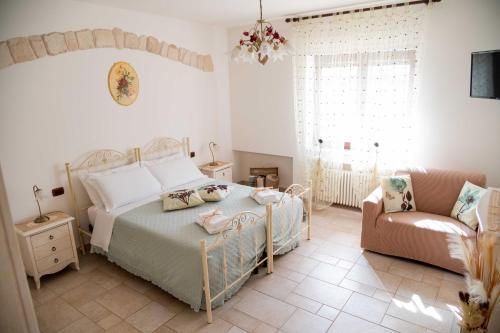 Ένα ή περισσότερα κρεβάτια σε δωμάτιο στο Dimora Aia Piccola