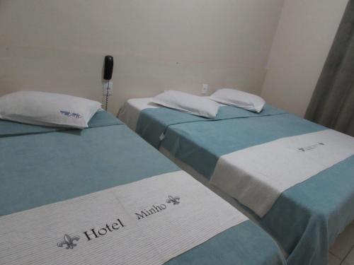 Postel nebo postele na pokoji v ubytování Hotel Minho - Próximo 25 de Março Brás e Bom Retiro e Hospital Pérola Byington "Garanta já a sua Reserva"