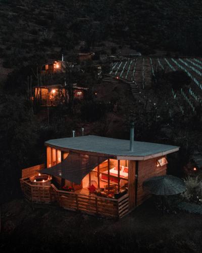 a house is lit up at night at Origen del Maipo Lodge in San José de Maipo