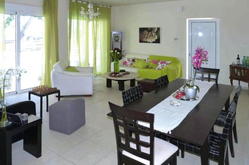 a living room with a table and a yellow couch at Villa in Nopigia with shared pool in Nopíyia