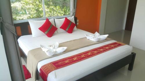 Ένα ή περισσότερα κρεβάτια σε δωμάτιο στο Phangan Guest House