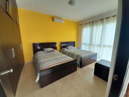 Säng eller sängar i ett rum på Apartamento en Playa Blanca - PANAMÁ