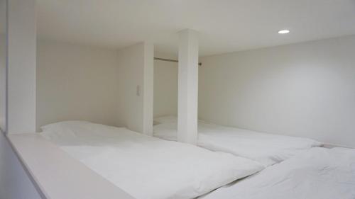 Postel nebo postele na pokoji v ubytování TRIP POD KOMONDO-MACHI