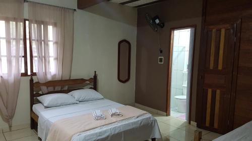 Residencia Pedra do Elefante tesisinde bir odada yatak veya yataklar