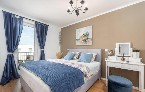 a bedroom with a bed and a window at Holiday House Businia with Whirlpool in Bužinija