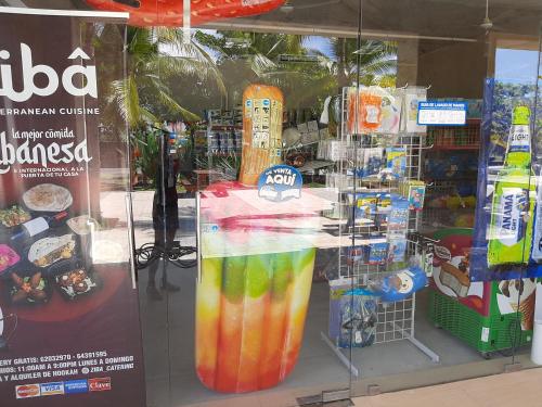 a display window of a store with a bunch of drinks at Apartamento en Playa Blanca - PANAMÁ in Río Hato