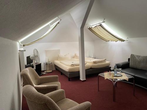 Säng eller sängar i ett rum på Hotel Rosengarten