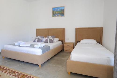 Ένα ή περισσότερα κρεβάτια σε δωμάτιο στο Vila Emen