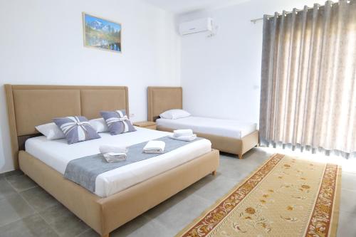 Ένα ή περισσότερα κρεβάτια σε δωμάτιο στο Vila Emen
