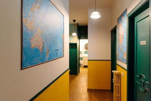 a hallway with a map of the world on the wall at Habari We Dorm in Bari