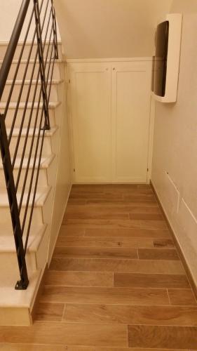 an empty room with stairs and a closet at Casa Mafalda in Chioggia