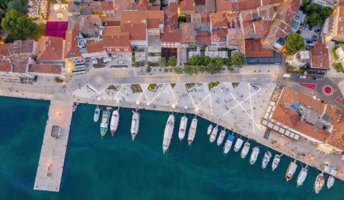 an overhead view of a harbor with boats in the water at City Square Apartment in Poreč