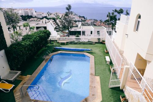 a large swimming pool in the middle of a building at Studio Jacaranda in Santiago del Teide