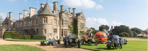 a group of motorcycles parked in front of a castle at Large modern self contained apartment in Lymington in Lymington