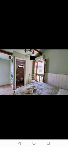 a bedroom with a large bed and a mirror at Del Castello in San Benedetto del Tronto