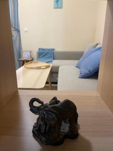 a statue of an elephant on a table in a living room at Tiny Bijou Sea View studio - Santa Marina - Sozopol in Sozopol