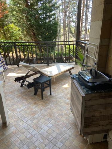 a patio with a picnic table and a grill at Tiny Bijou Sea View studio - Santa Marina - Sozopol in Sozopol