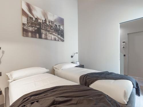 En eller flere senger på et rom på The Best Rent - Spacious apartment in Paolo Sarpi