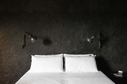 Palazzo Daniele, a Member of Design Hotelsにあるベッド