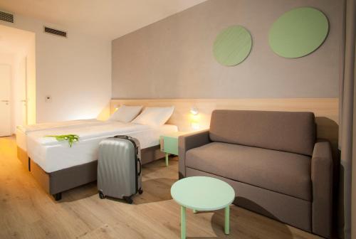 Un pat sau paturi într-o cameră la Terme Topolsica - Hotel Vesna