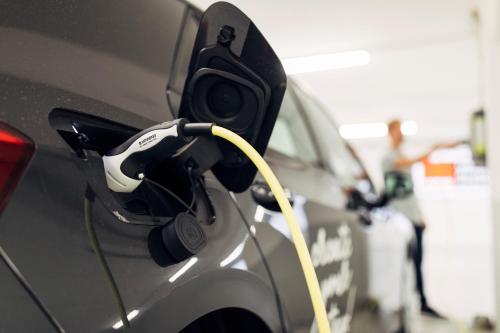 a car is hooked up to a car charger at harry's home Telfs hotel & apartments in Telfs